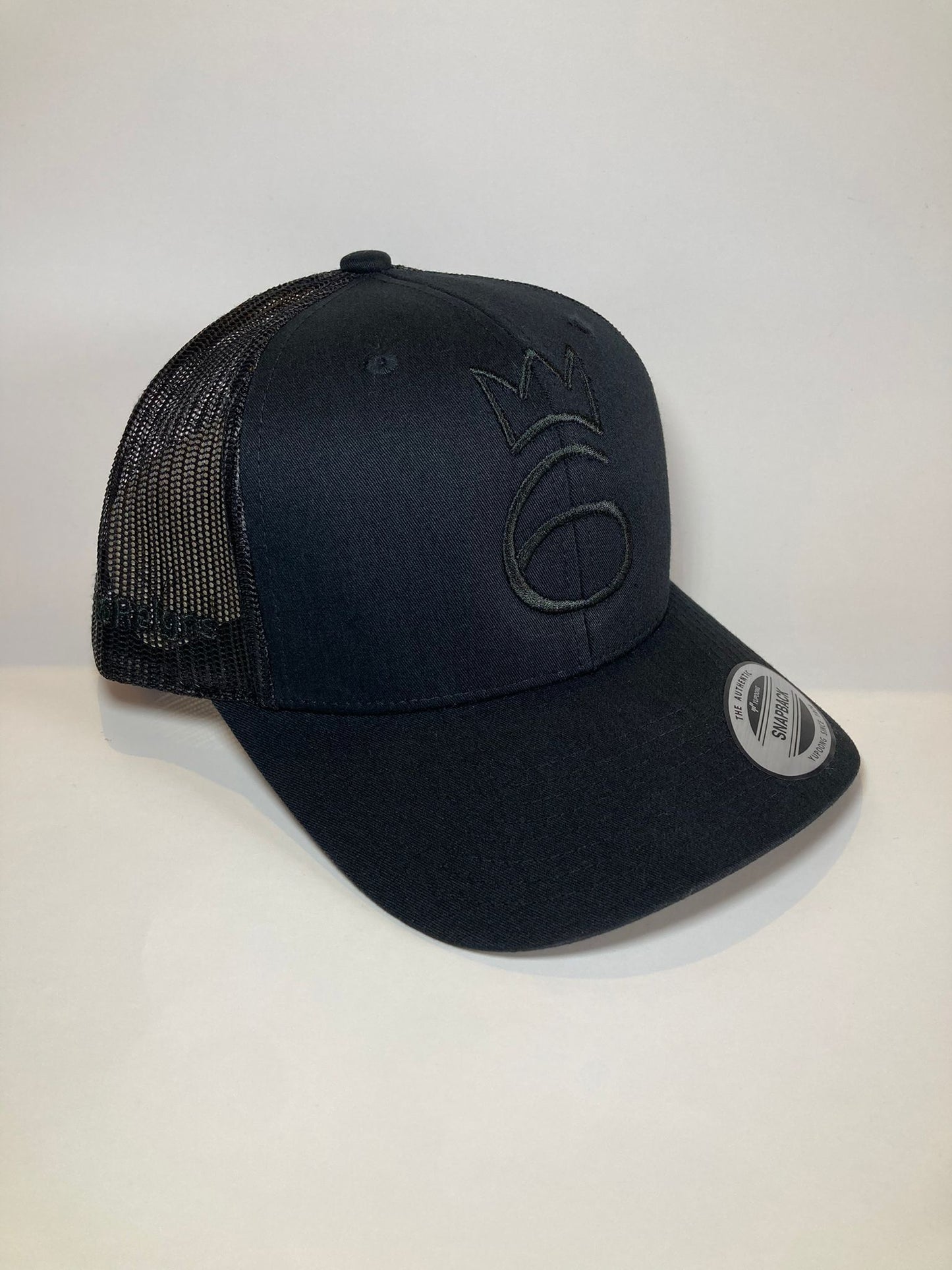 classic lightweight twill cap in black with grey crown logo and mesh back.