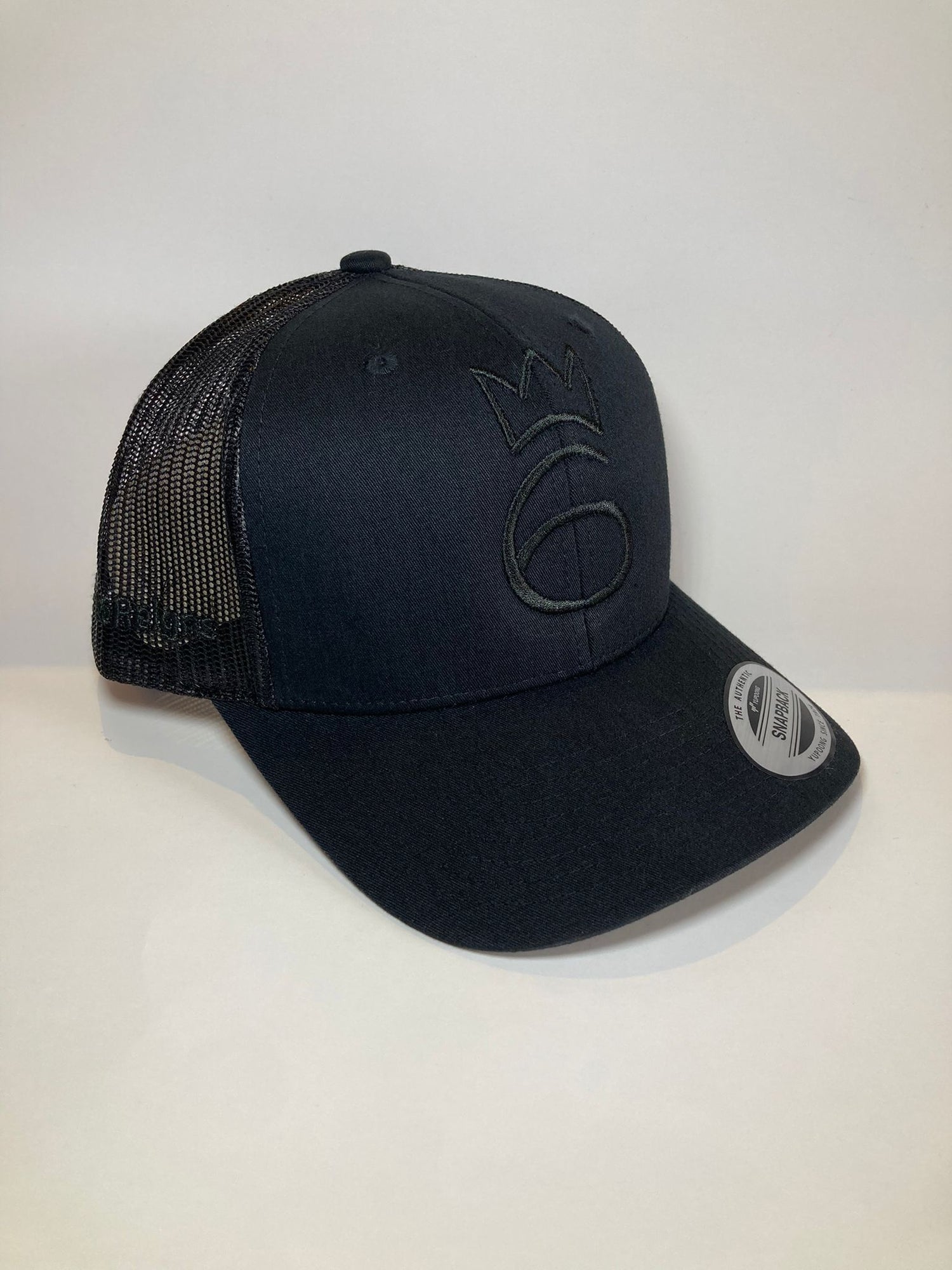 classic lightweight twill cap in black with grey crown logo and mesh back.
